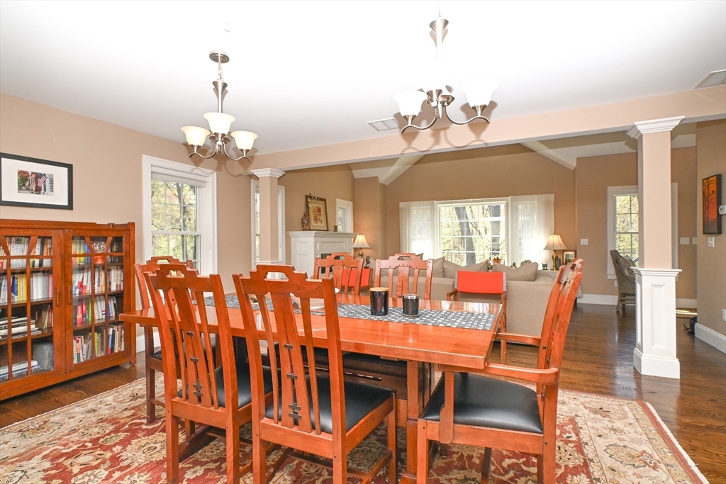 60 Harding Street, Unit C Medfield, MA 02052 - Photo 16 of 41 a view of a dining room with furniture wooden floor and chandelier