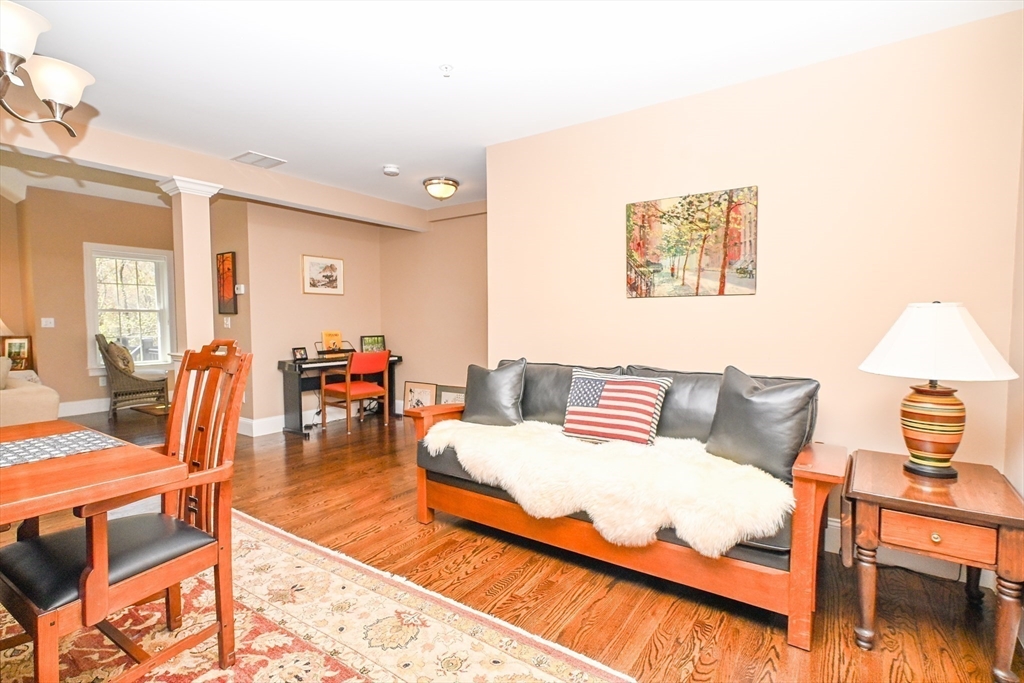 60 Harding Street, Unit C Medfield, MA 02052 - Photo 18 of 41 a living room with furniture and a wooden floor