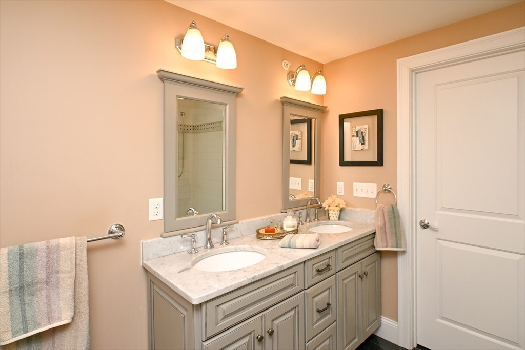 60 Harding Street, Unit C Medfield, MA 02052 - Photo 21 of 41 a bathroom with a sink and a mirror