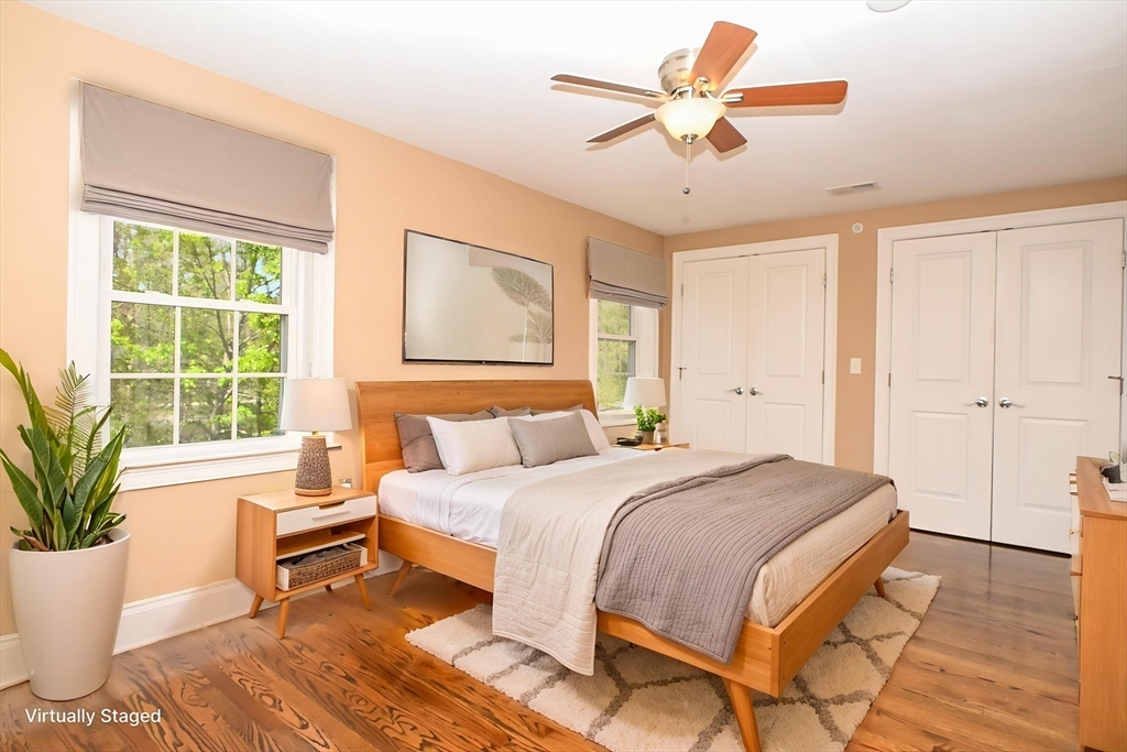 60 Harding Street, Unit C Medfield, MA 02052 - Photo 23 of 41 a bedroom with a large bed and a potted plant