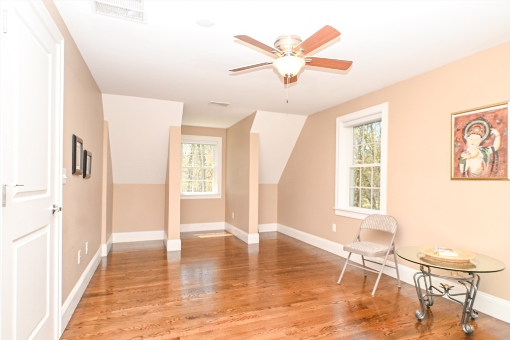 60 Harding Street, Unit C Medfield, MA 02052 - Photo 25 of 41 a view of a livingroom with a furniture wooden floor and a window