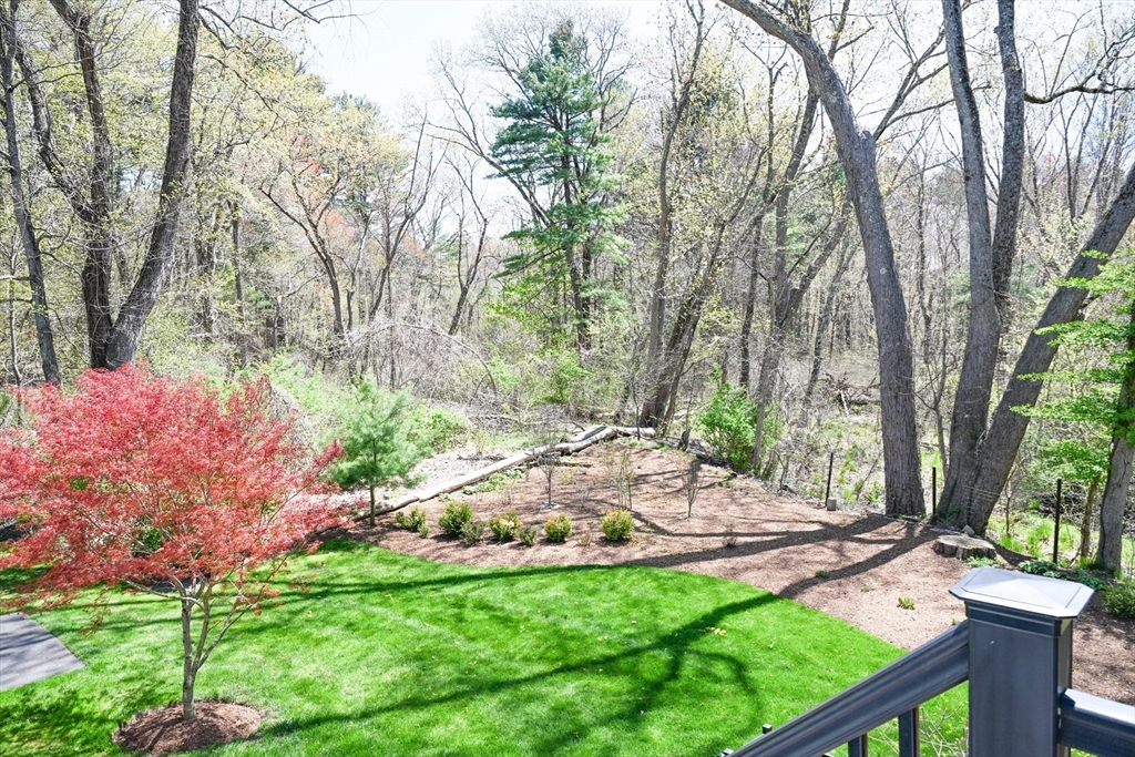 60 Harding Street, Unit C Medfield, MA 02052 - Photo 4 of 41 a backyard of a house with table and chairs