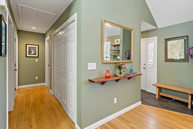 a view of a room with shelves and wooden floor