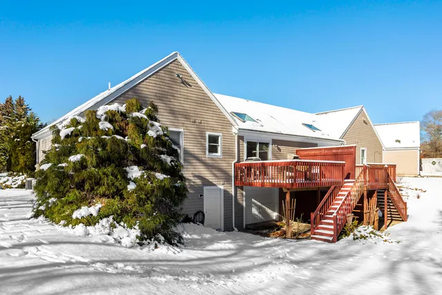 a view of a two chairs in the patio