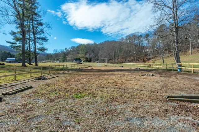 a view of a yard with a trampoline