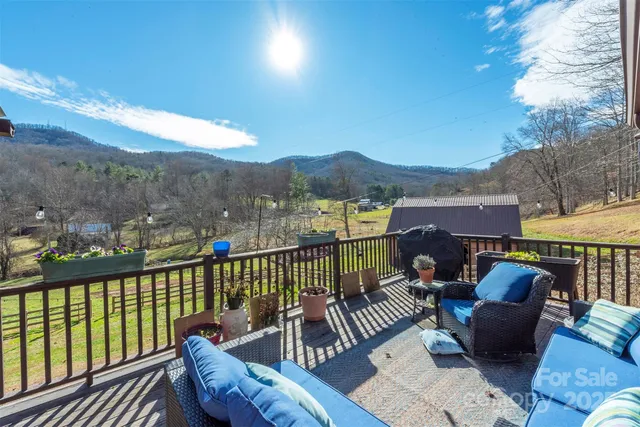 a view of balcony with couch and wooden floor
