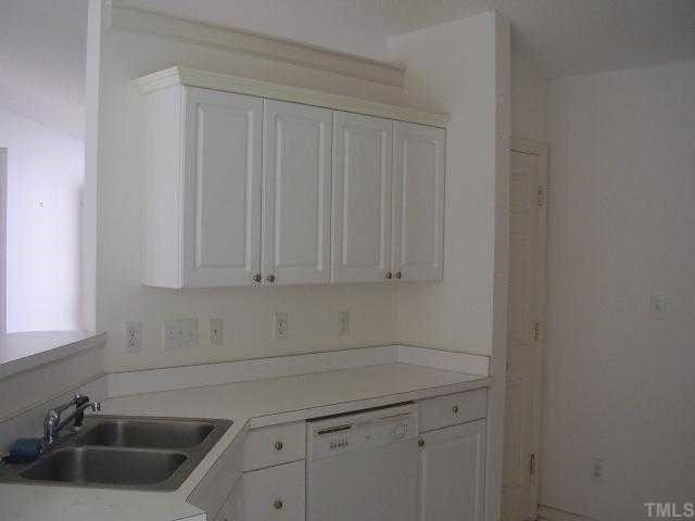 7113 Missionary Ridge Drive Raleigh, NC 27610 - Photo 3 of 3 a view of a kitchen with white cabinets