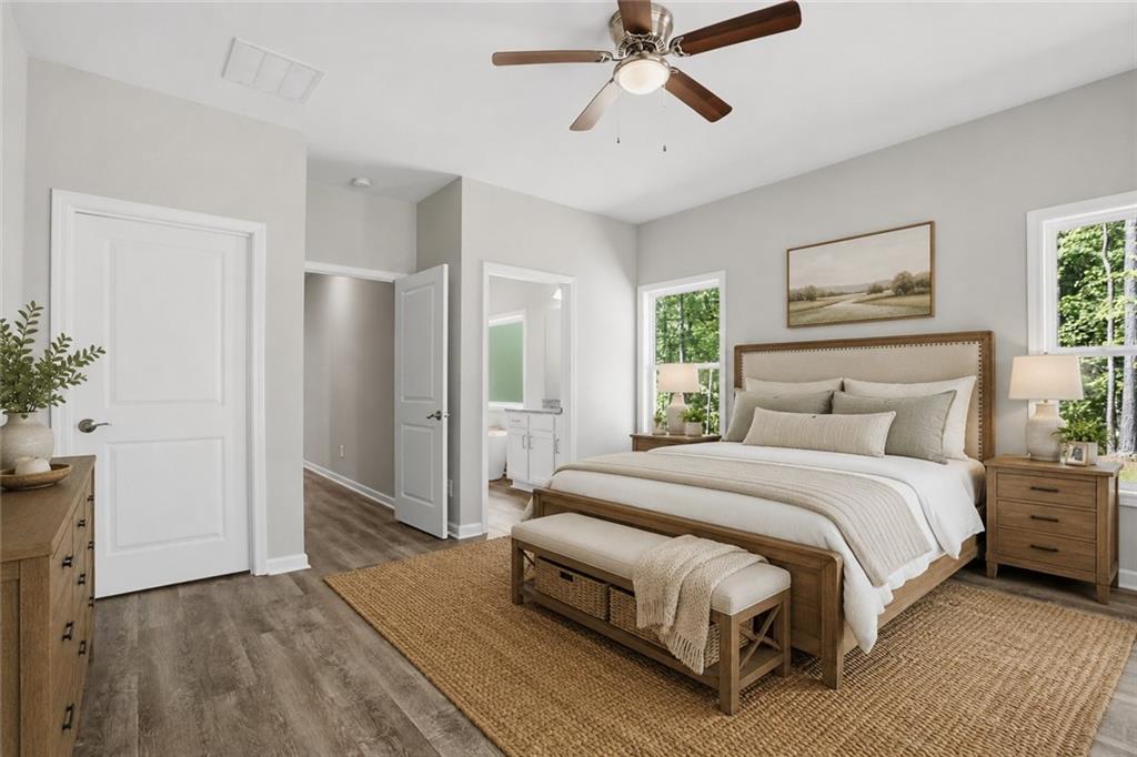 314 Coady Road Jackson, GA 30233 - Photo 18 of 31 a bedroom with a bed and wooden floor