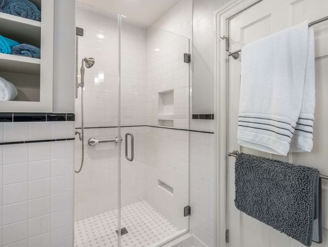 a bathroom with a shower and a sink