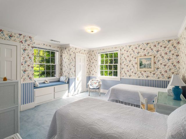 a spacious bedroom with a large bed and a couch