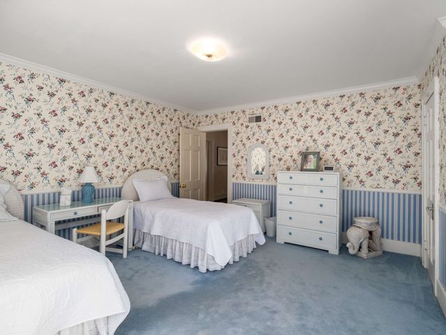 a bedroom with bed and a lamp