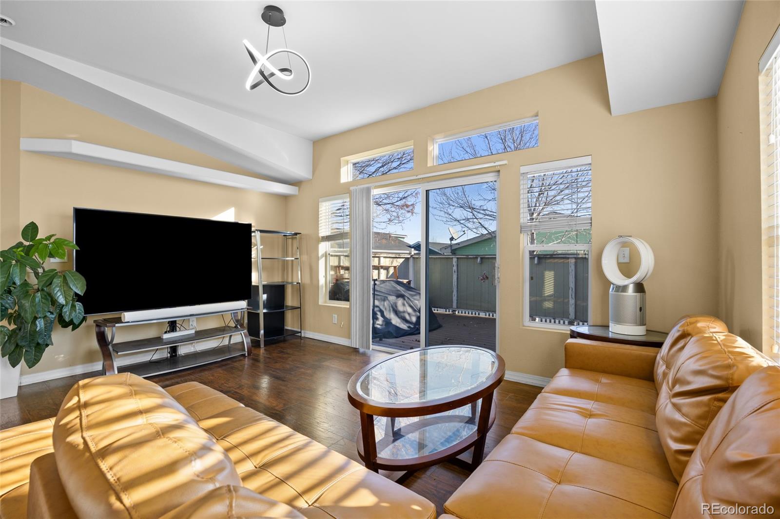 6160 Mallow Green, Unit 272 Frederick, CO 80530 - Photo 4 of 14 a living room with furniture and a flat screen tv