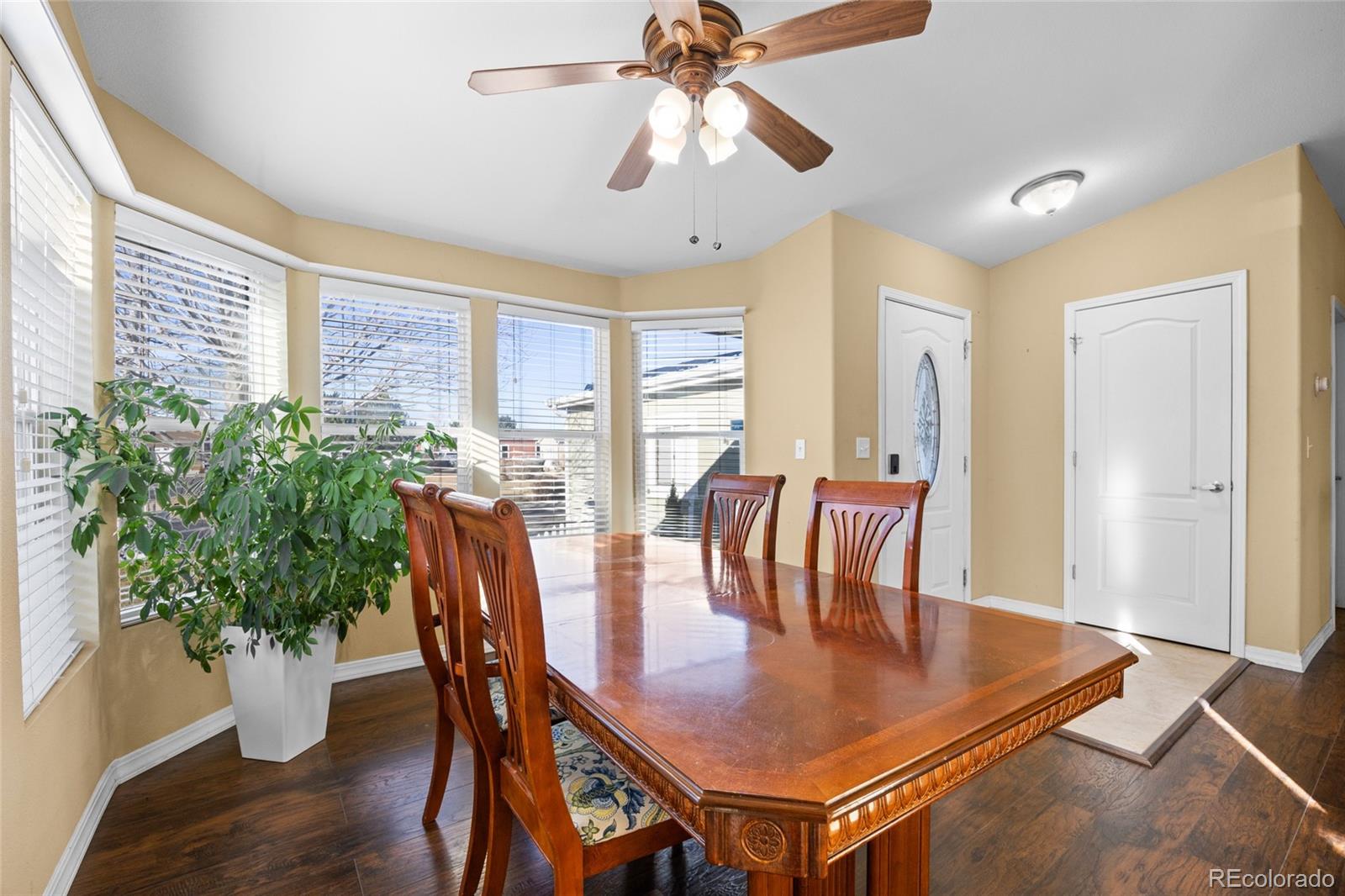 6160 Mallow Green, Unit 272 Frederick, CO 80530 - Photo 8 of 14 a view of a dining room with furniture window and wooden floor