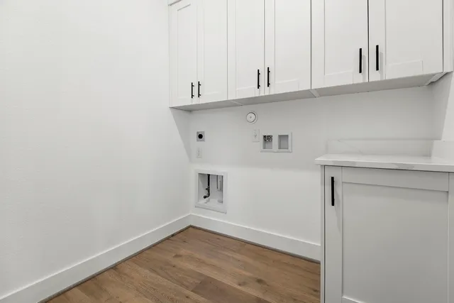 a view of cabinets and wooden floor