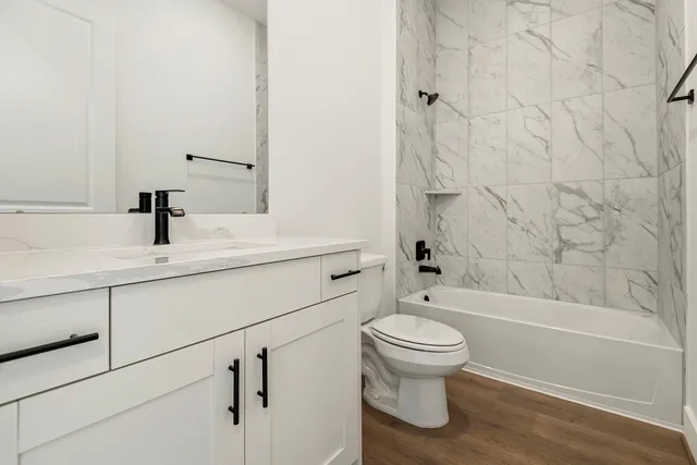 a bathroom with a sink a toilet and a bathtub