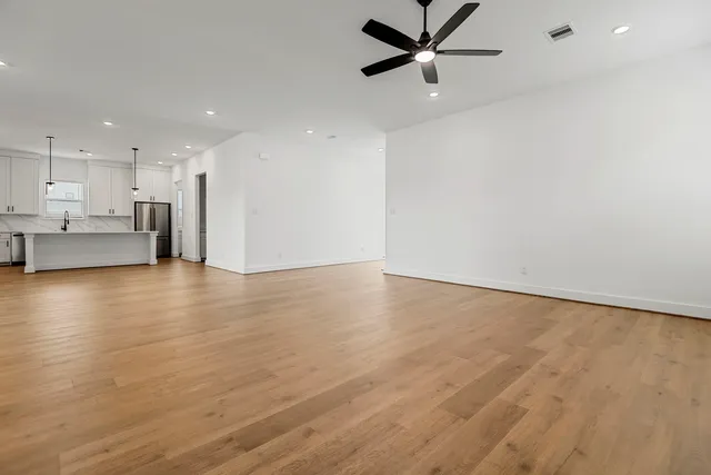 a view of a kitchen with a sink and a window