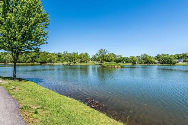 0 Treemont Road Dickson, TN 37055 - Photo 7 of 9 a view of a lake with houses in the back