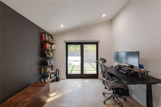 a bedroom with a bed and a couch