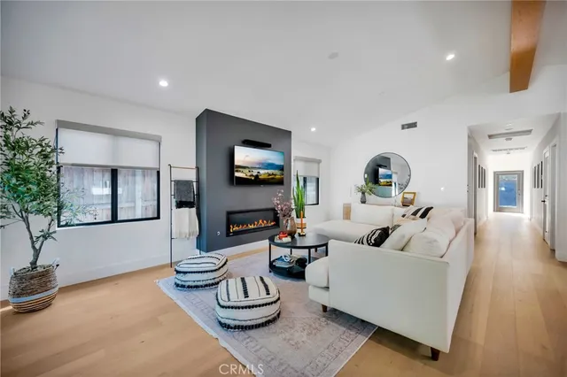 a living room with furniture a table and chairs