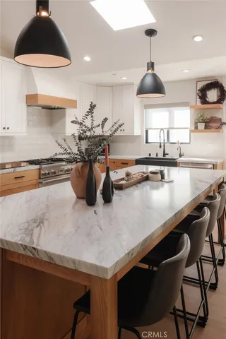 a kitchen with a stove and a refrigerator