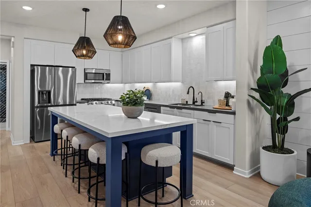 a kitchen with a table and chairs