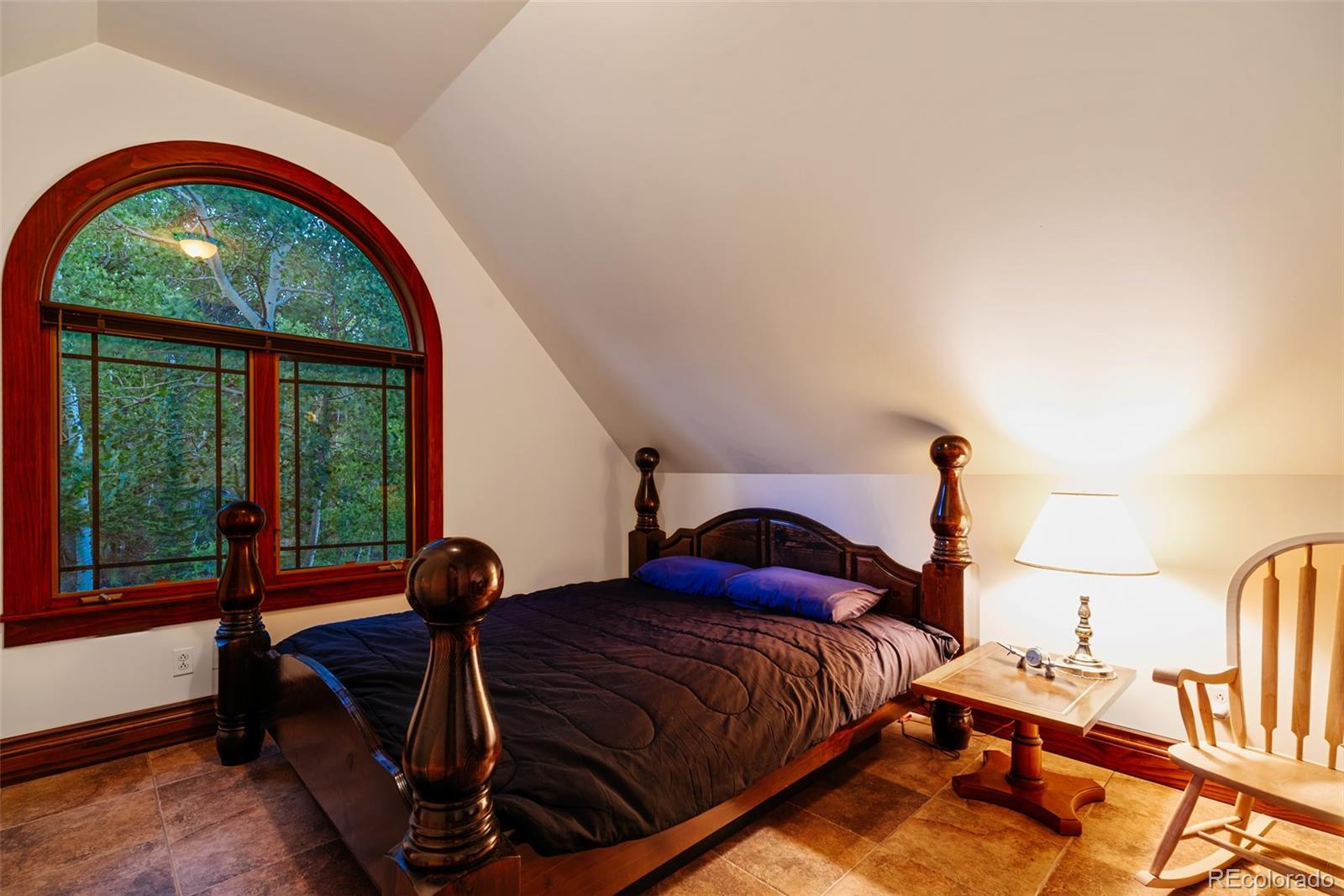 1023 Raven Way Como, CO 80432 - Photo 19 of 40 a bedroom with a bed and window