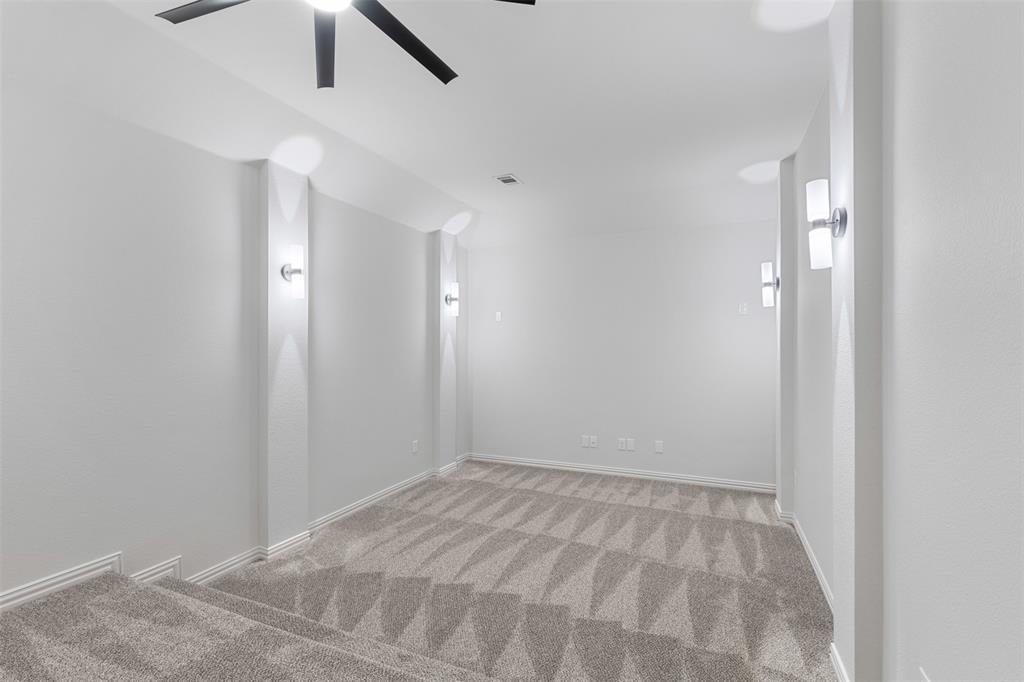 11984 Del Rio Drive Frisco, TX 75035 - Photo 24 of 38 Spare room with baseboards, light carpet, and ceiling fan