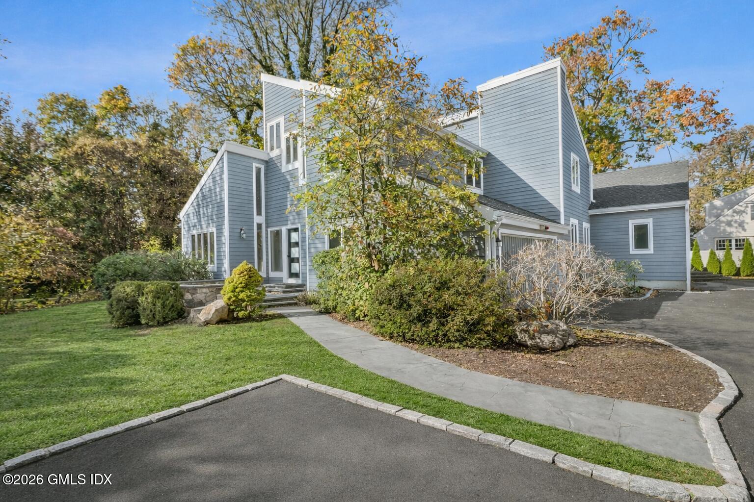 145 R Shore Road Old Greenwich, CT 06870 - Photo 1 of 40 Bright autumn day at a modern home