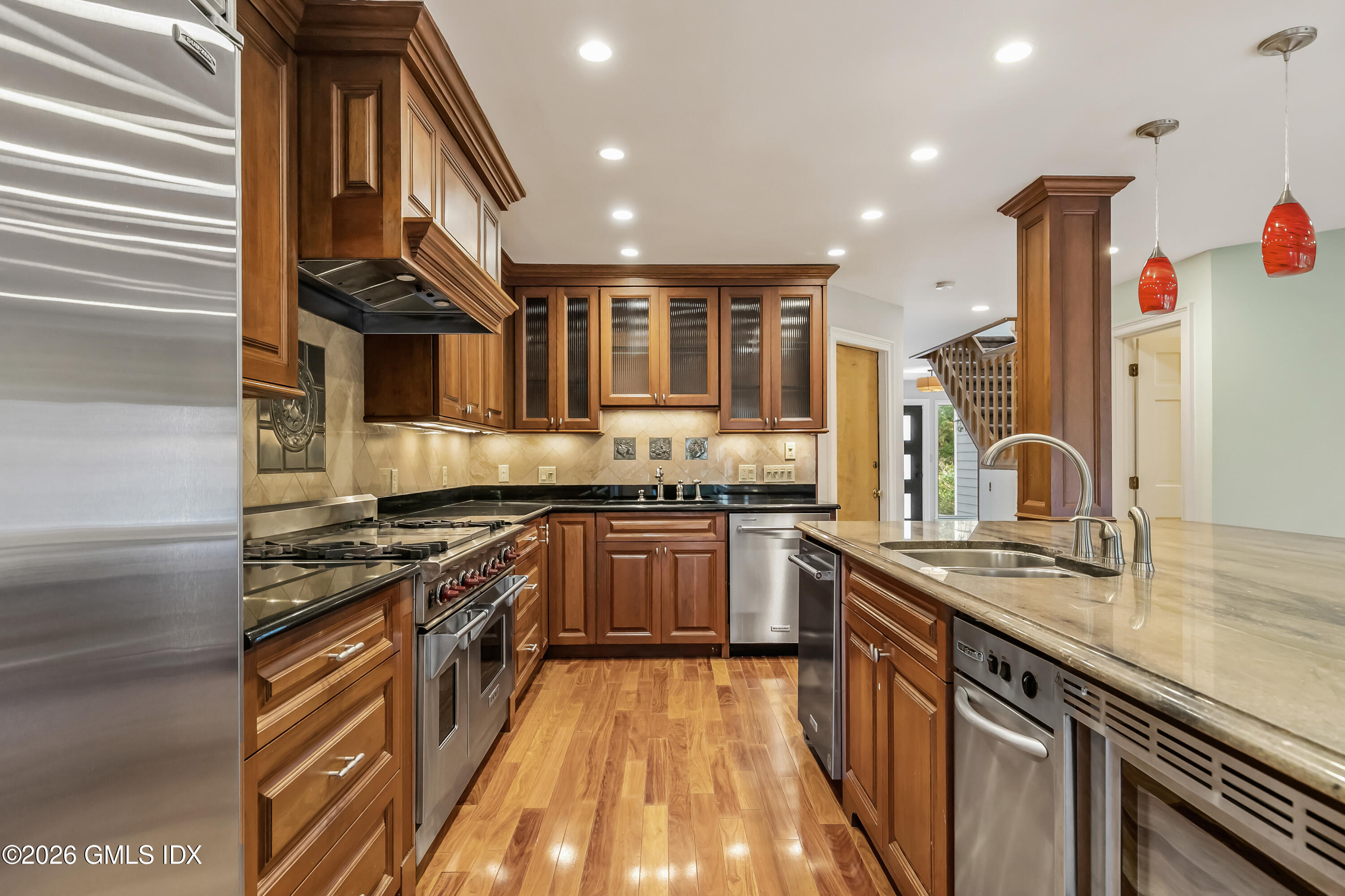 145 R Shore Road Old Greenwich, CT 06870 - Photo 13 of 41 a kitchen with stainless steel appliances granite countertop a sink and a stove