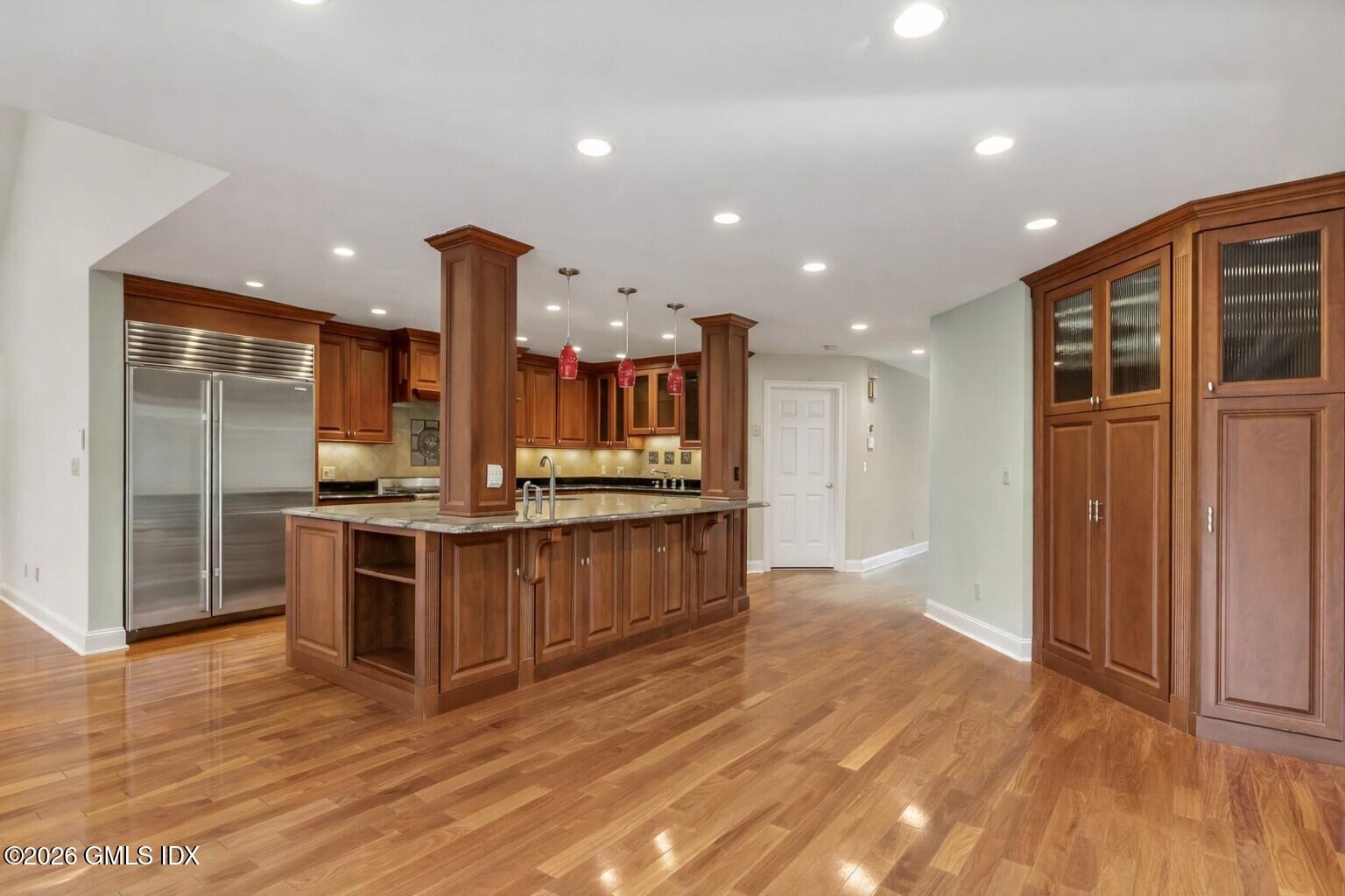 145 R Shore Road Old Greenwich, CT 06870 - Photo 17 of 41 a large kitchen with stainless steel appliances kitchen island a large counter top and stove top oven