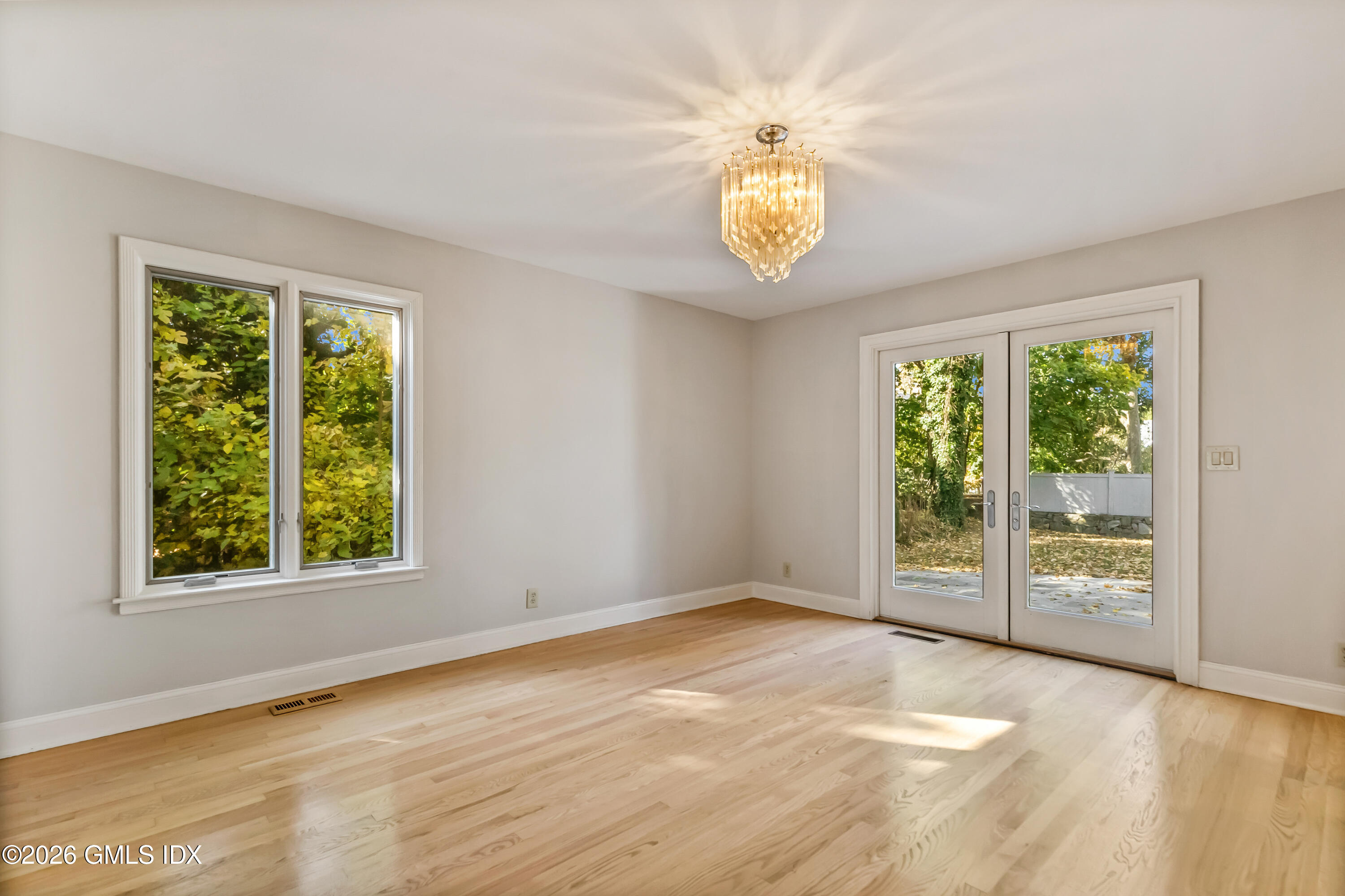 145 R Shore Road Old Greenwich, CT 06870 - Photo 10 of 41 a view of an empty room with a window