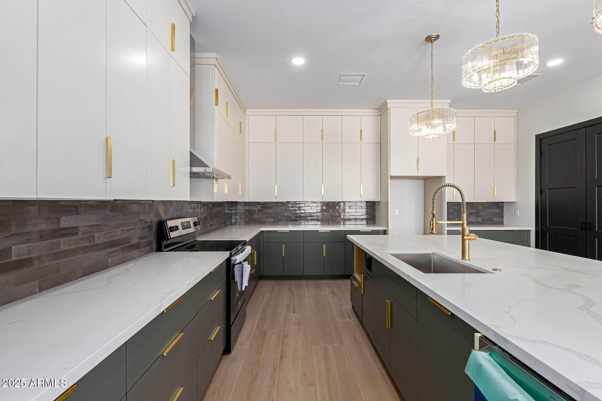 25117 West McArthur Road Wittmann, AZ 85361 - Photo 12 of 43 a kitchen with a sink dishwasher a stove and a refrigerator with wooden floor