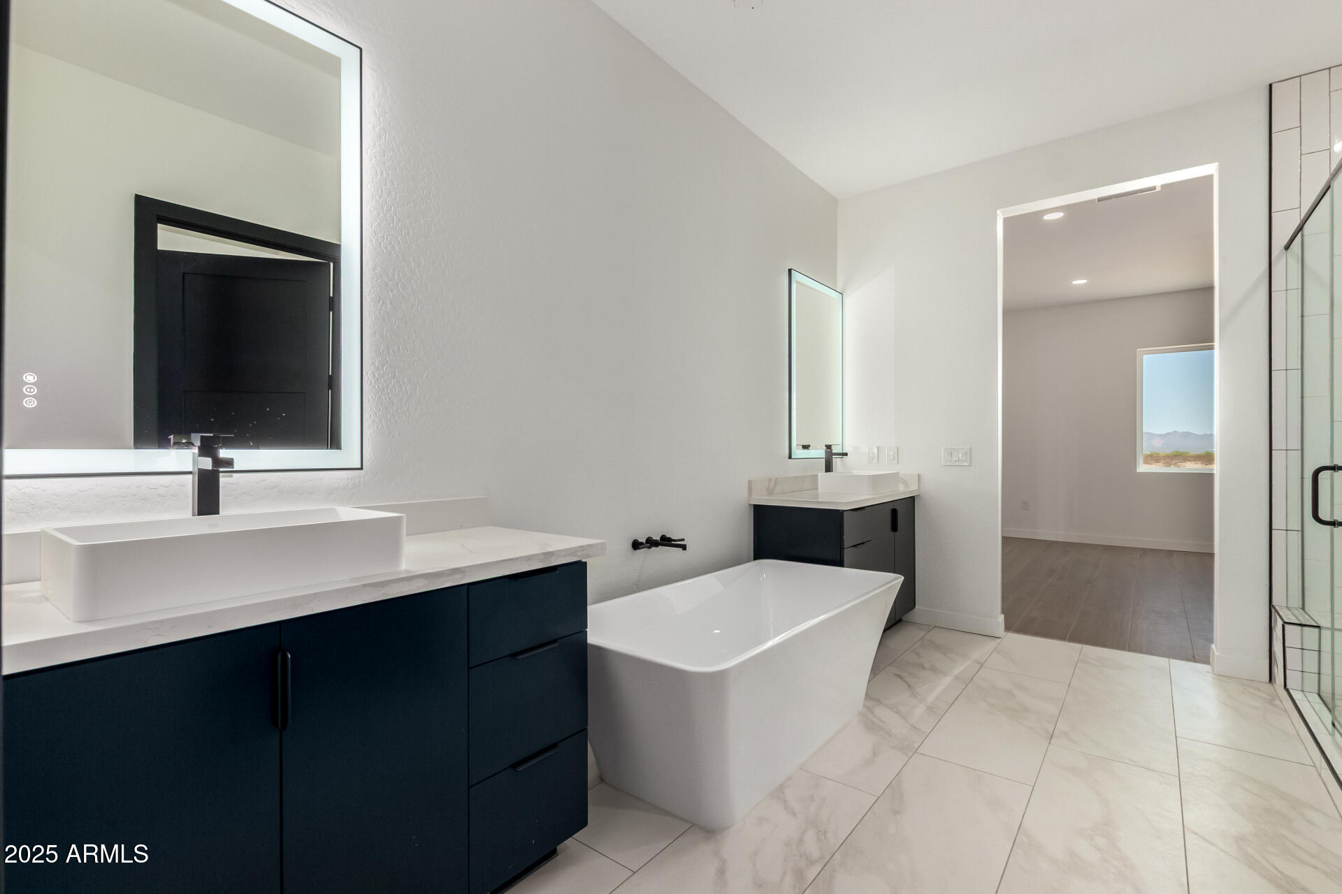 25117 West McArthur Road Wittmann, AZ 85361 - Photo 21 of 43 a bathroom with a sink and a mirror