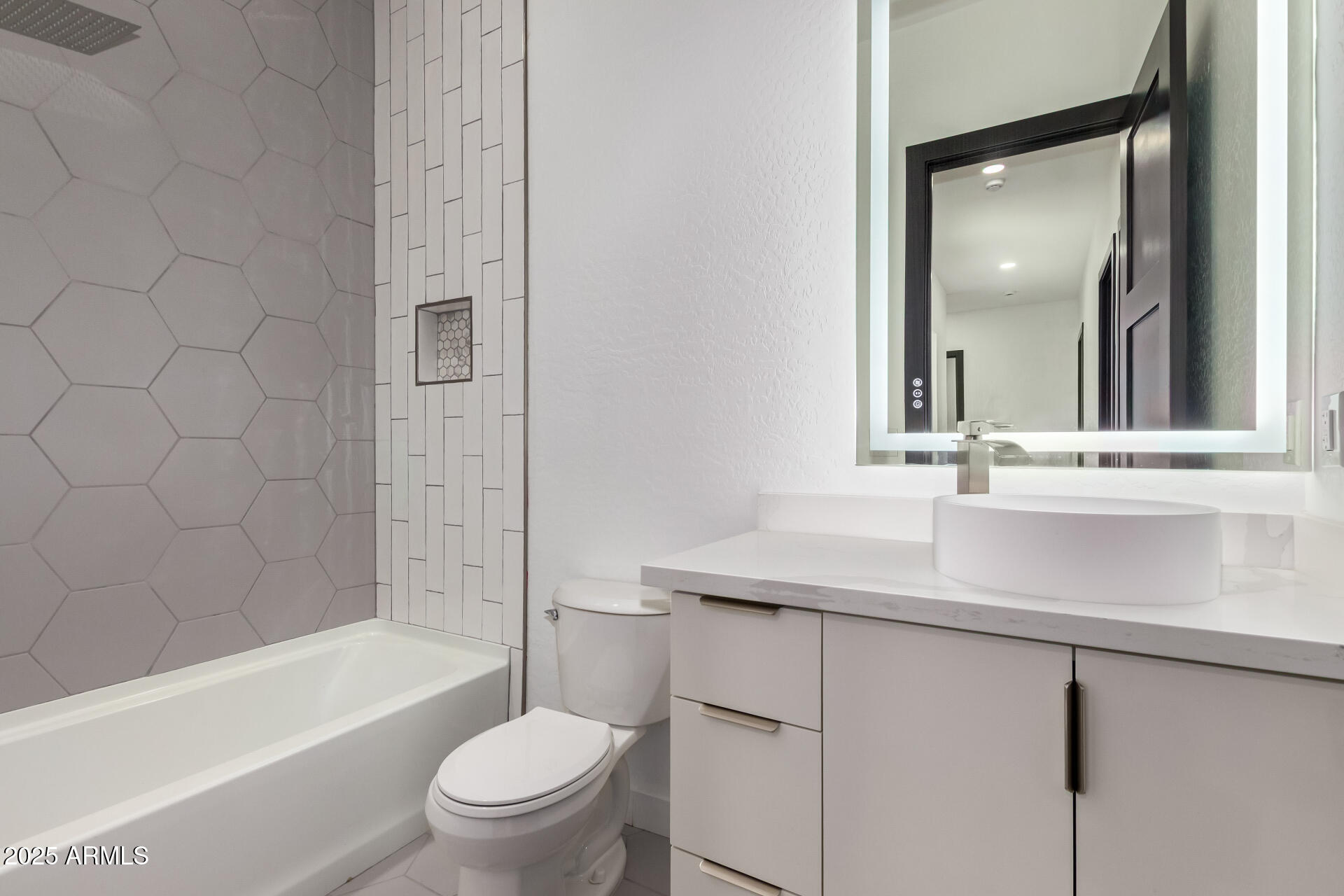 25117 West McArthur Road Wittmann, AZ 85361 - Photo 26 of 43 a bathroom with a sink and a mirror