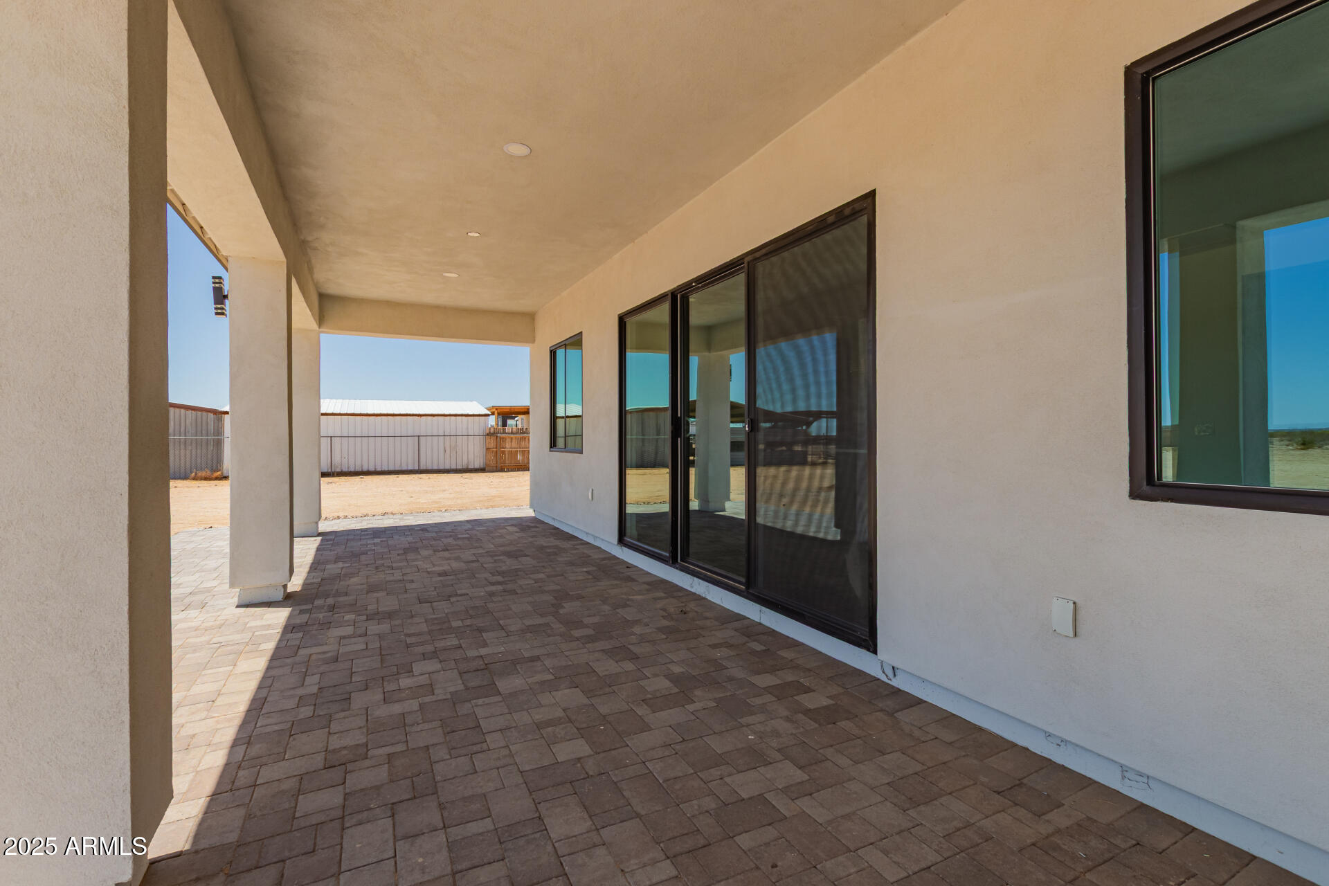 25117 West McArthur Road Wittmann, AZ 85361 - Photo 39 of 43 a view of hallway with a large window and kitchen view