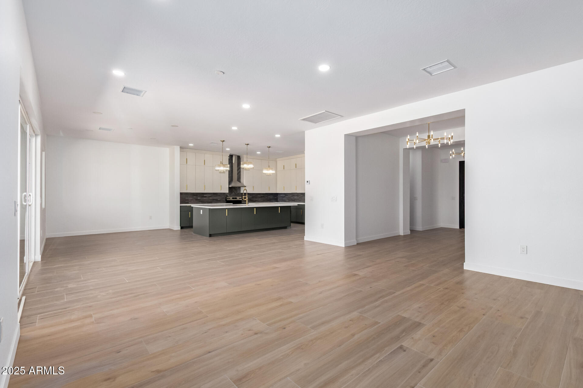 25117 West McArthur Road Wittmann, AZ 85361 - Photo 7 of 43 a view of a kitchen with a sink and a refrigerator