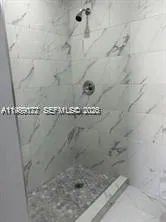 a close view of a shower in bathroom