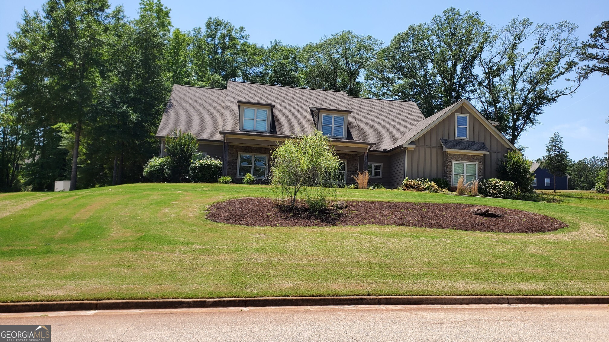 a front view of a house with a yard
