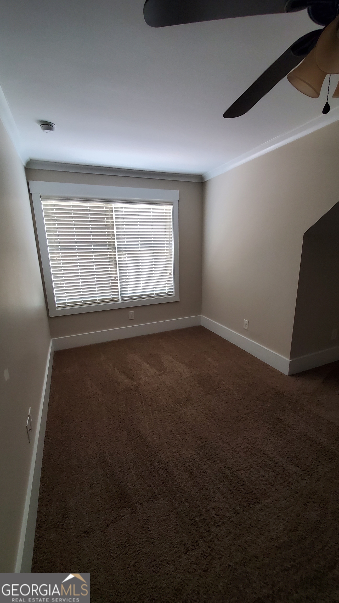 90 Alcovy Reserve Way Covington, GA 30014 - Photo 22 of 28 an empty room with wooden floor and windows