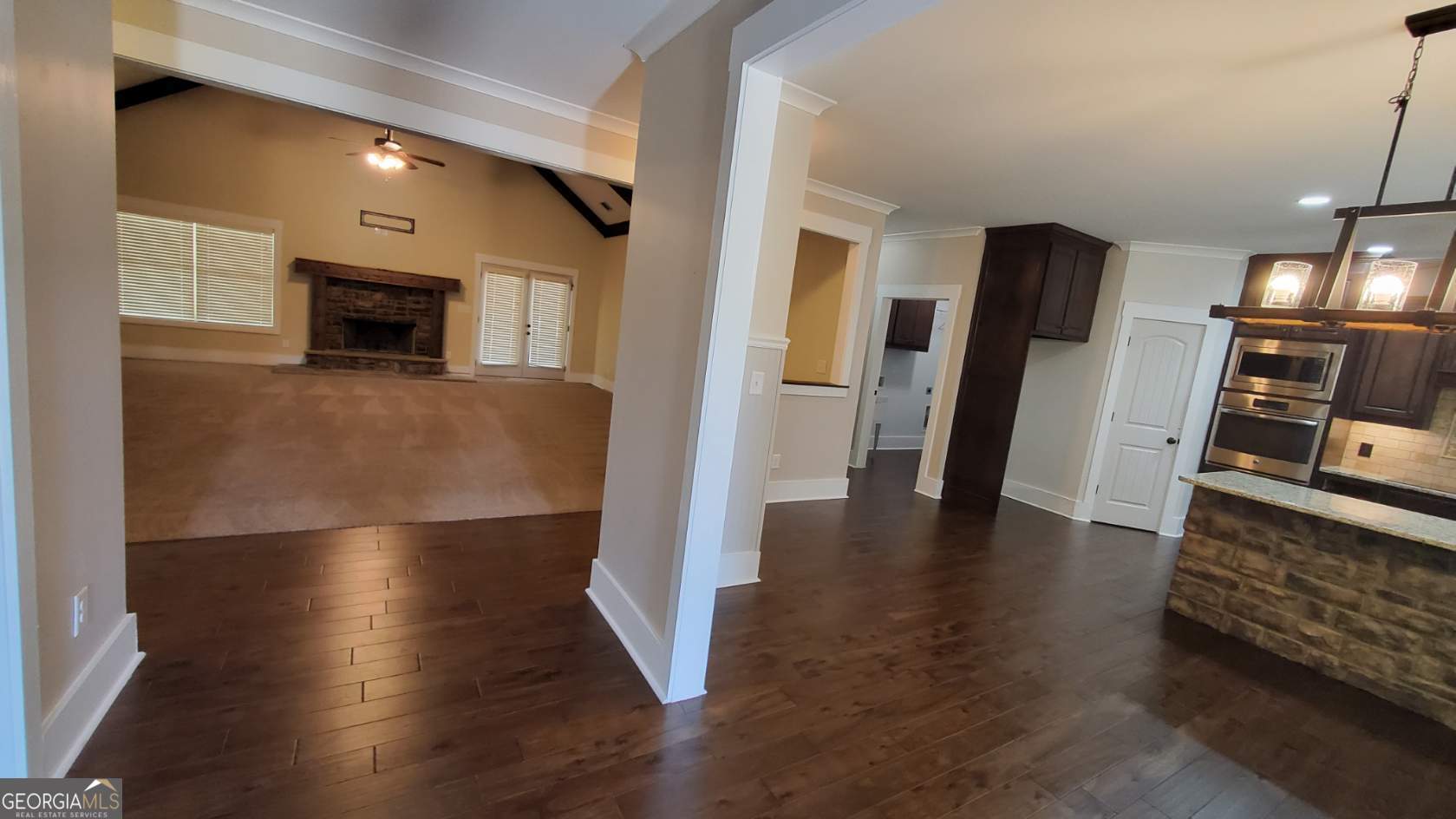 90 Alcovy Reserve Way Covington, GA 30014 - Photo 8 of 28 a view of a living room a refrigerator and a stove