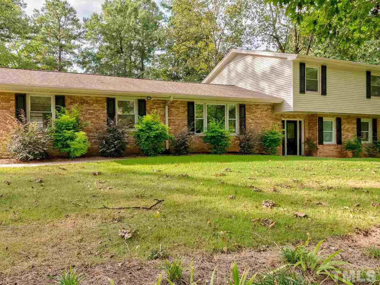 1016 Winona Road Raleigh, NC 27609 - Photo 1 of 25 a front view of a house with garden