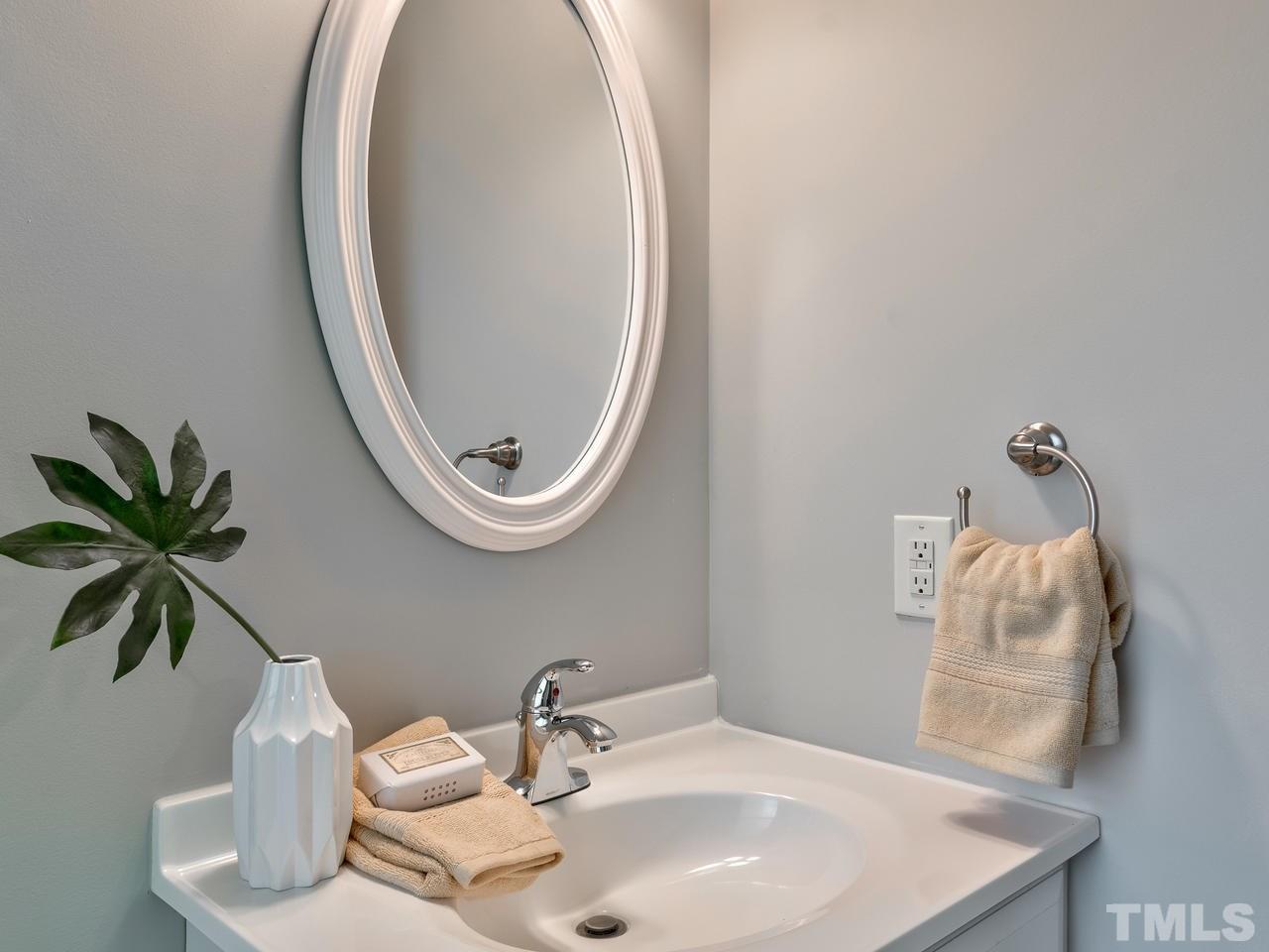 1016 Winona Road Raleigh, NC 27609 - Photo 11 of 25 a bathroom with a sink and a mirror