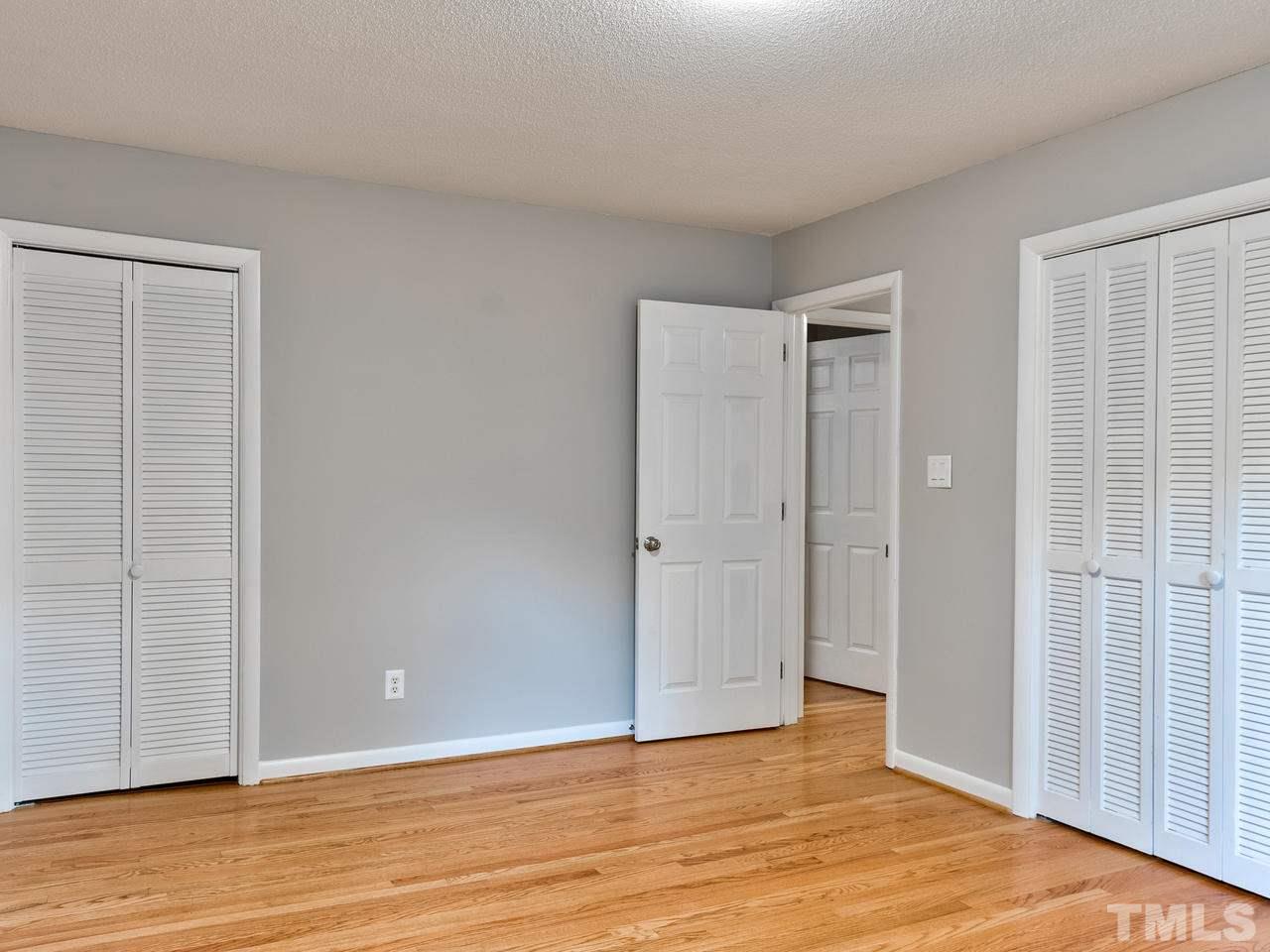 1016 Winona Road Raleigh, NC 27609 - Photo 12 of 25 a view of an empty room with wooden floor