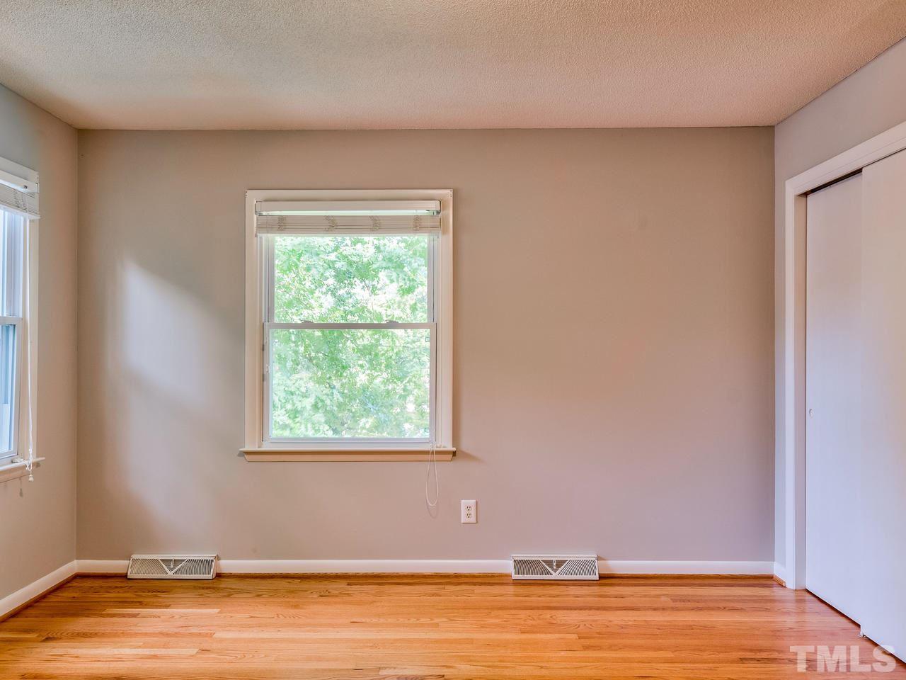 1016 Winona Road Raleigh, NC 27609 - Photo 17 of 25 a view of a room with wooden floor and a window