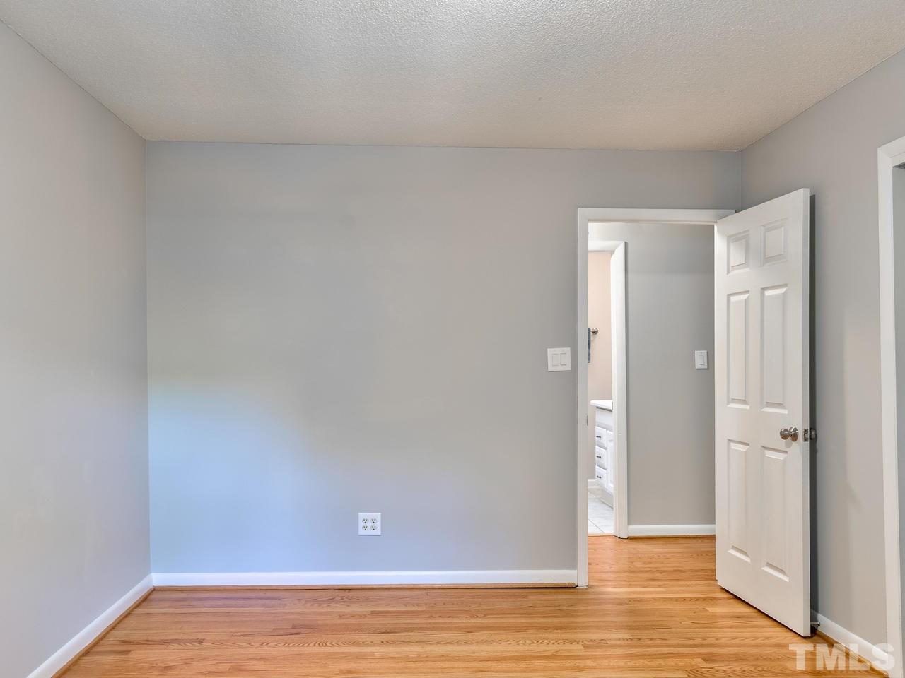1016 Winona Road Raleigh, NC 27609 - Photo 18 of 25 a view of an empty room and wooden floor