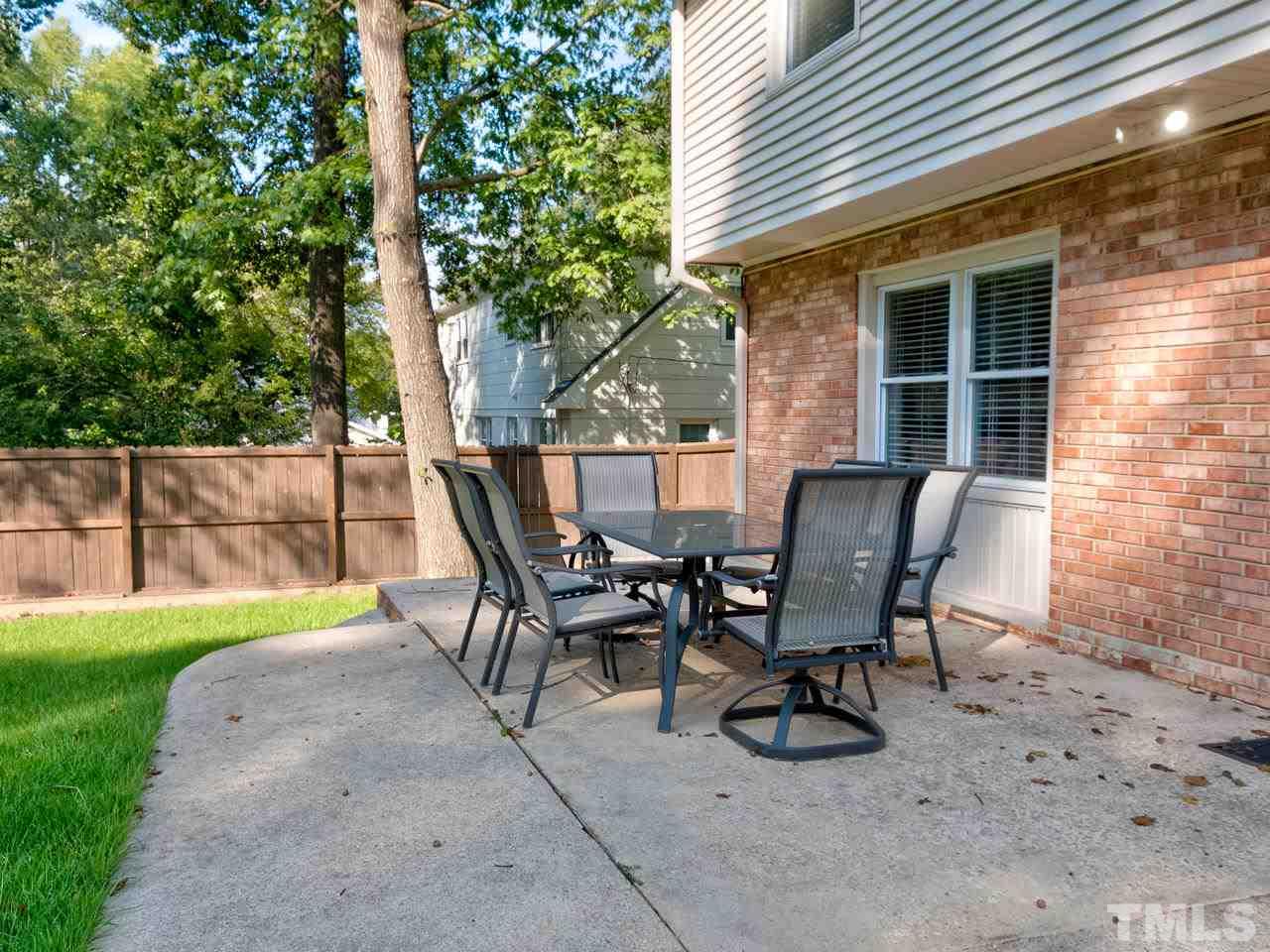 1016 Winona Road Raleigh, NC 27609 - Photo 20 of 25 a view of a house with a backyard and sitting area