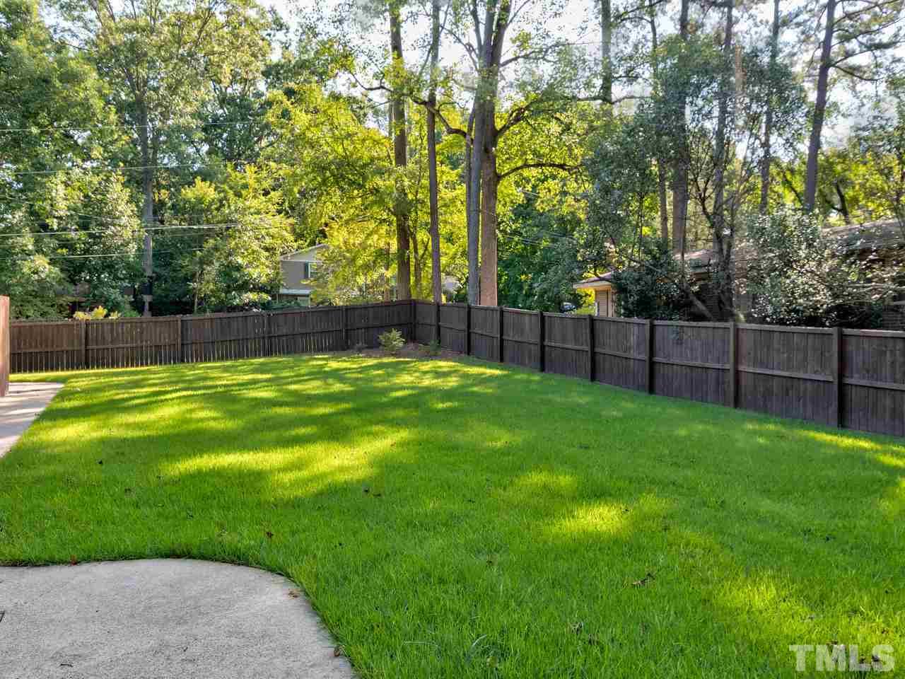 1016 Winona Road Raleigh, NC 27609 - Photo 21 of 25 a view of yard with trees in the background