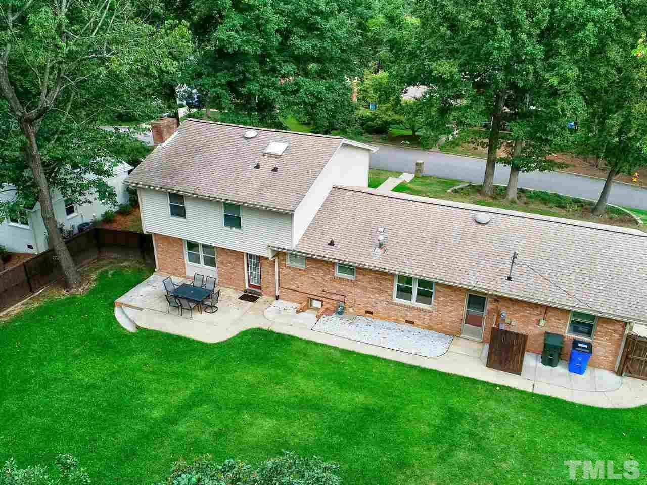1016 Winona Road Raleigh, NC 27609 - Photo 25 of 25 an aerial view of a house with backyard porch and sitting area