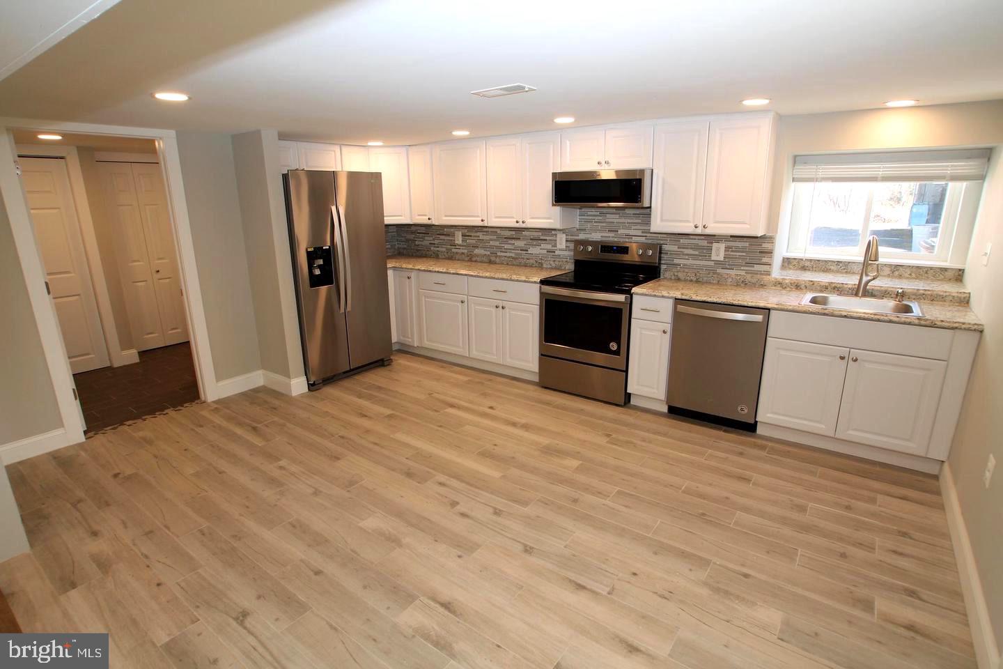 538 Durham Road Newtown, PA 18940 - Photo 4 of 11 a kitchen with granite countertop a refrigerator stove top oven and sink