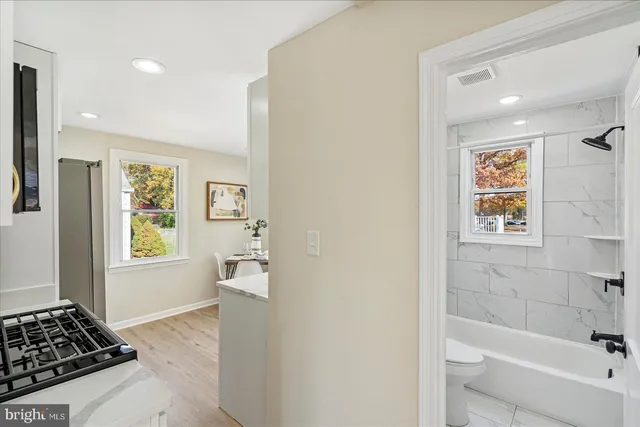 a bathroom with a bathtub and a shower